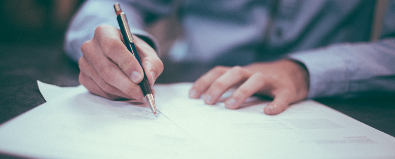 Man writing with Pen 